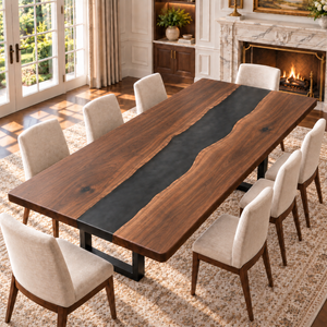 Black walnut table with a black epoxy river, shown with eight chairs in a bright dining room.