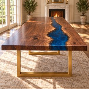 Front view of the Rivercrest walnut dining table with a blue epoxy river and gold-colored rectangular frame supports.