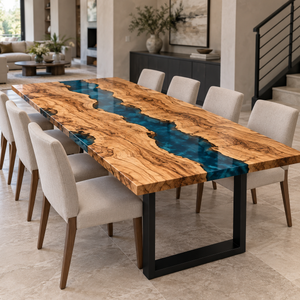 Olive wood blue epoxy resin dining table with cream chairs, viewed toward an adjoining living room